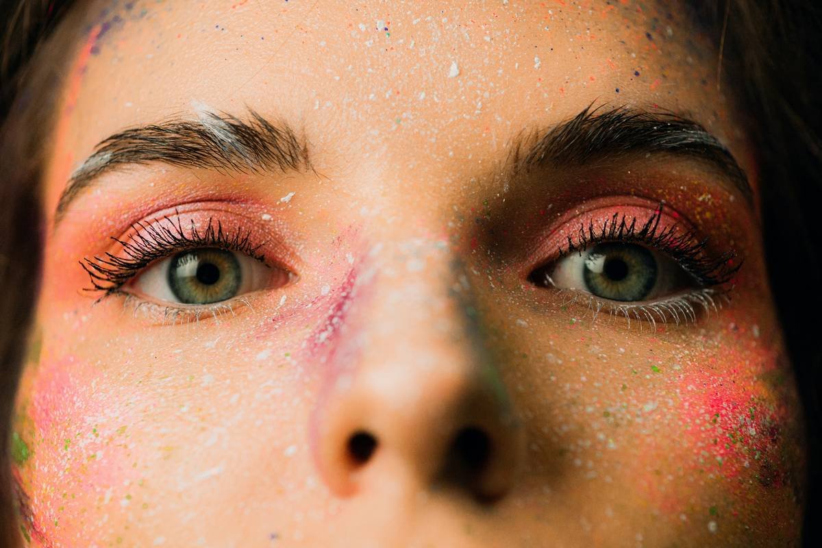 Close-up of creative makeup tutorials with multi-zone face art templates in action