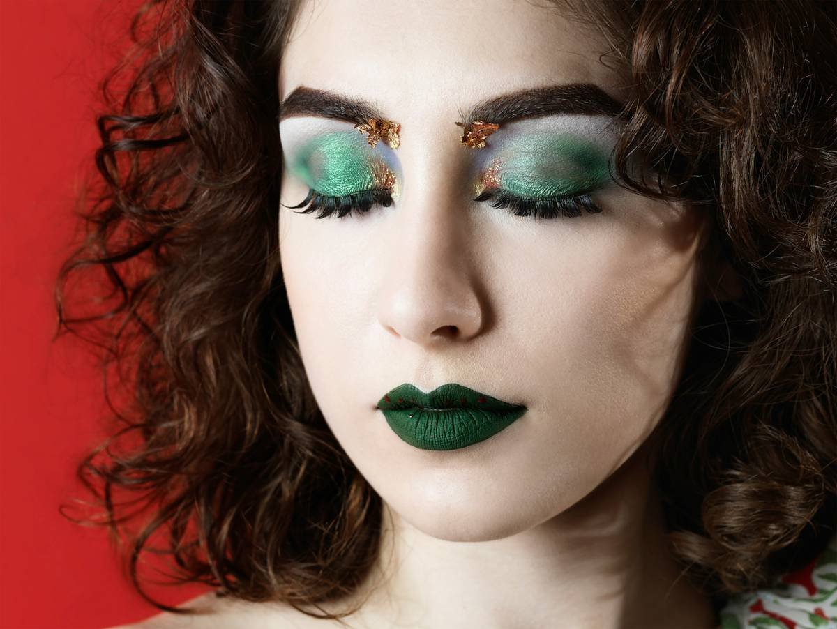 Close-up of intricate face art created with reusable makeup stencils showing sharp lines and blended edges for makeup design inspiration